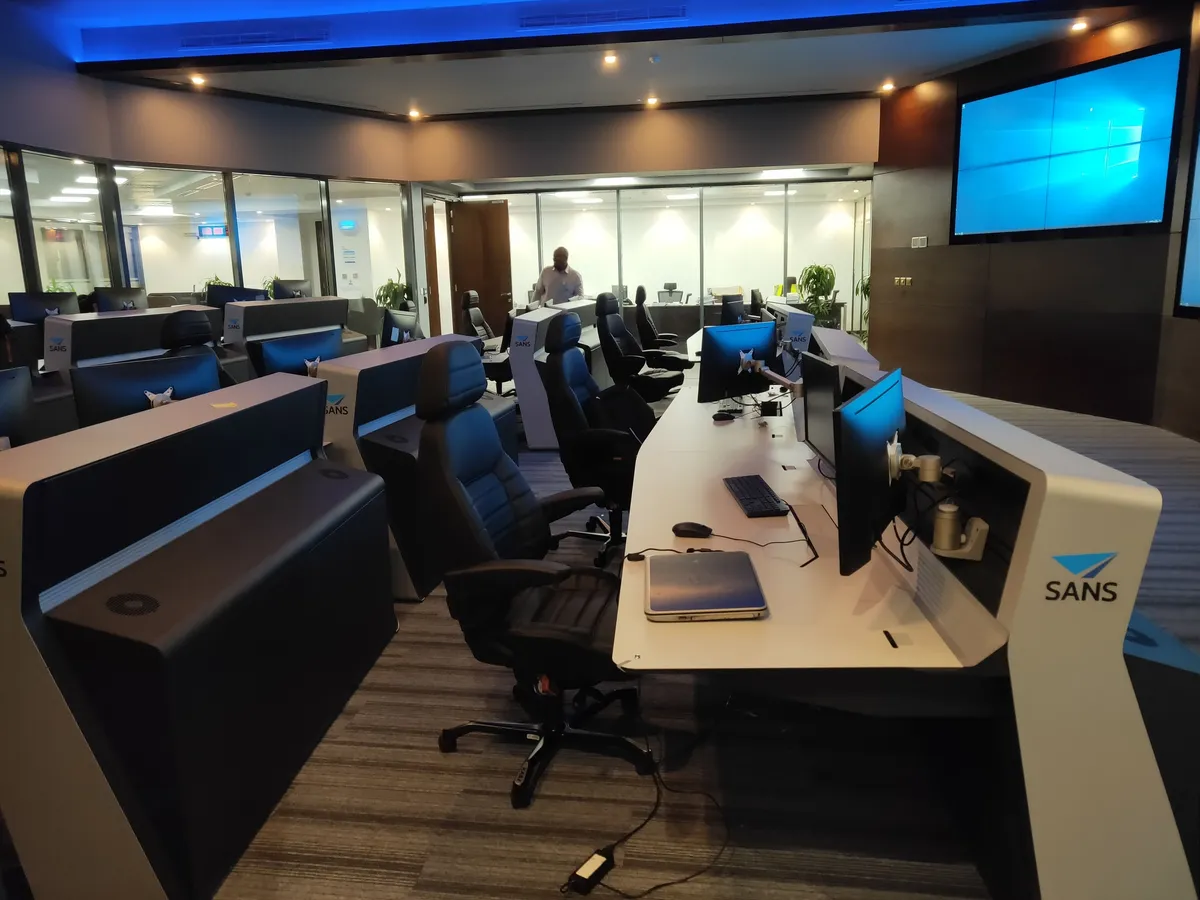 A console with monitors in the control room