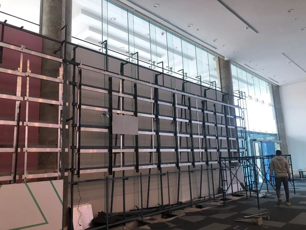 Mounting frame for a very wide LED wall behind a glass facade