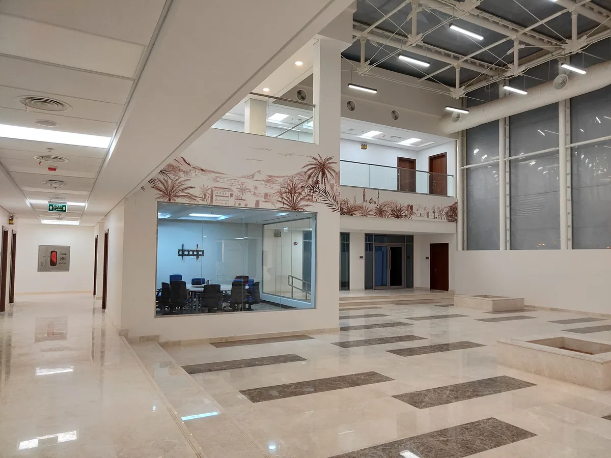 Atrium with a meeting room behind glass