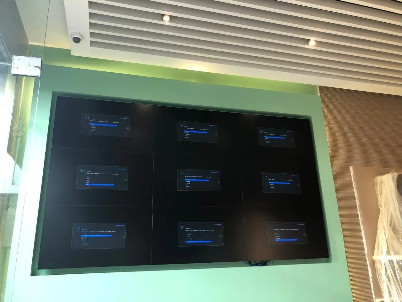 Three-by-three video wall installed in a wall recess