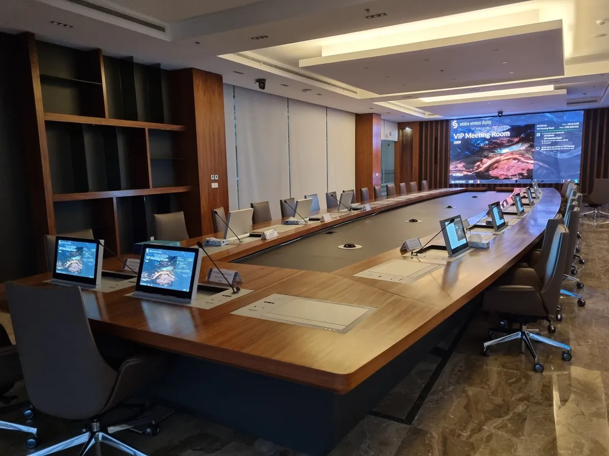 Board table with lift-up monitors and panoramic windows