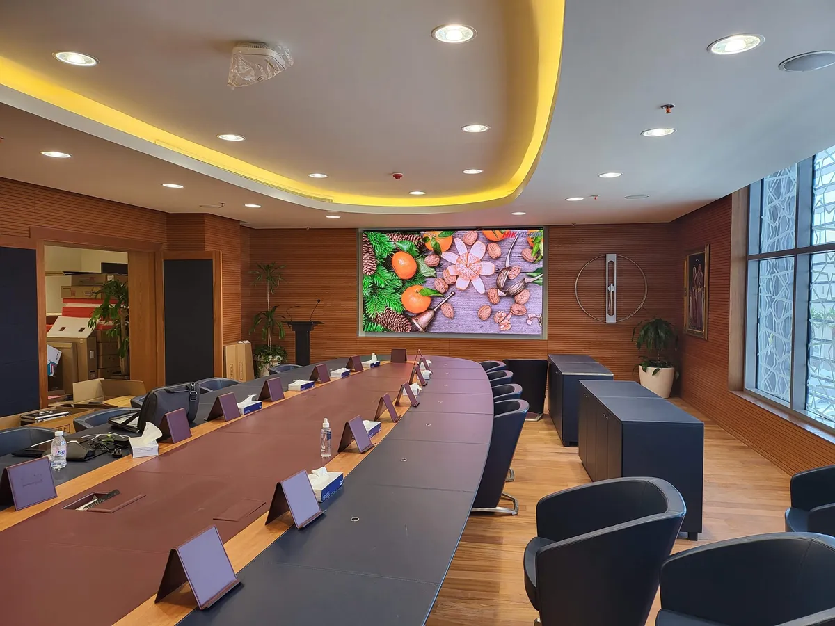 Boardroom LED wall and conference table with discussion units