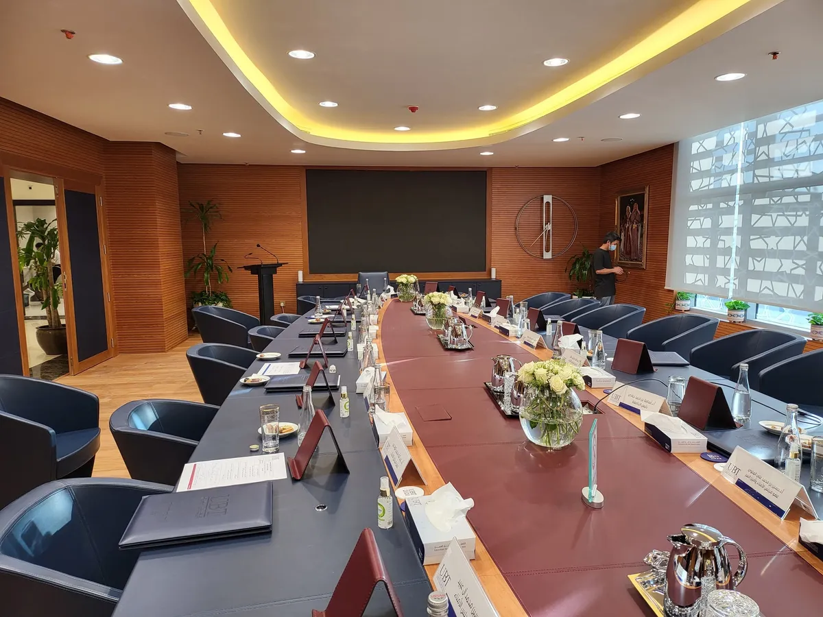 Conference table fitted with microphones and discussion units