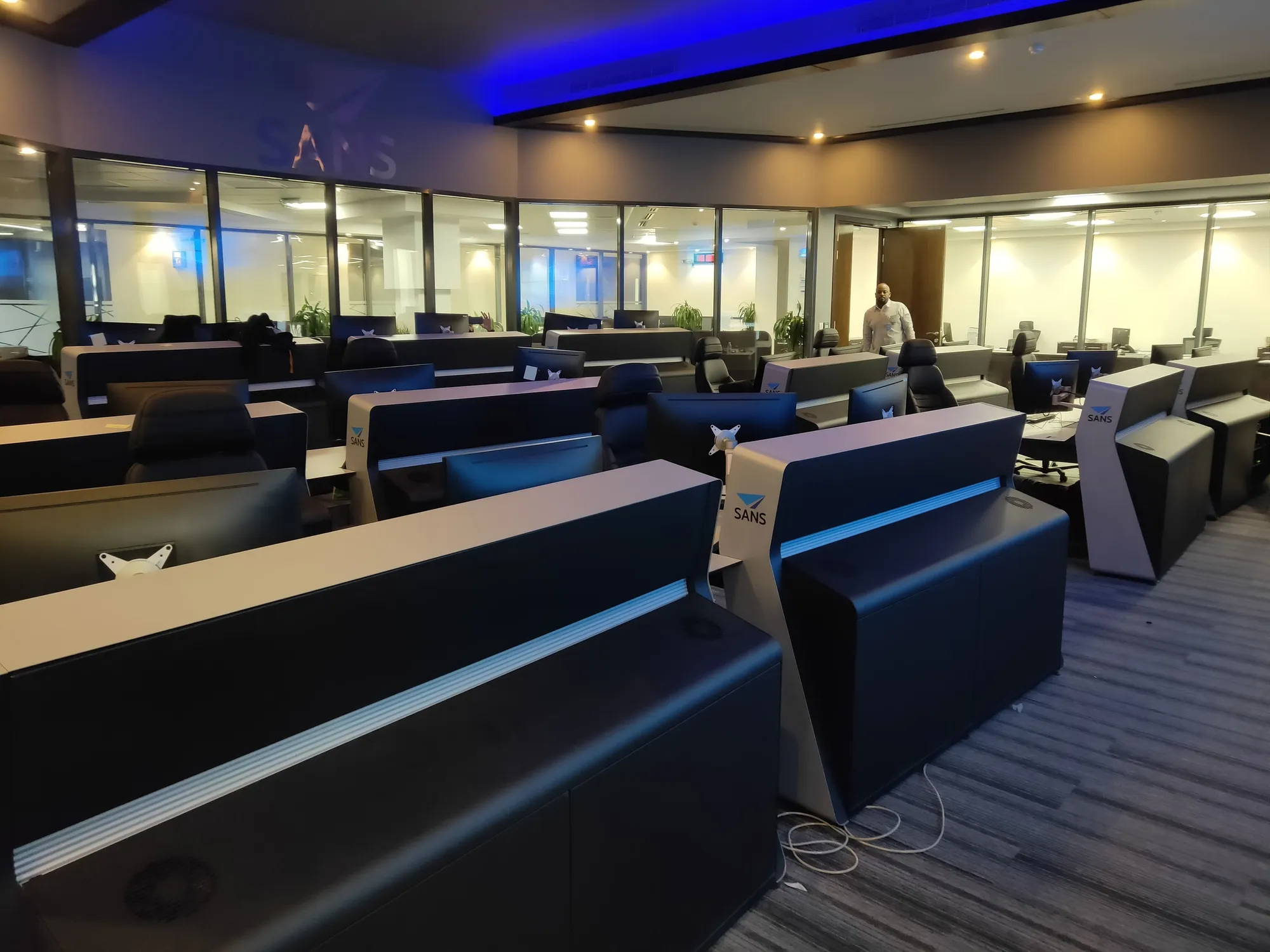 Rows of control room consoles