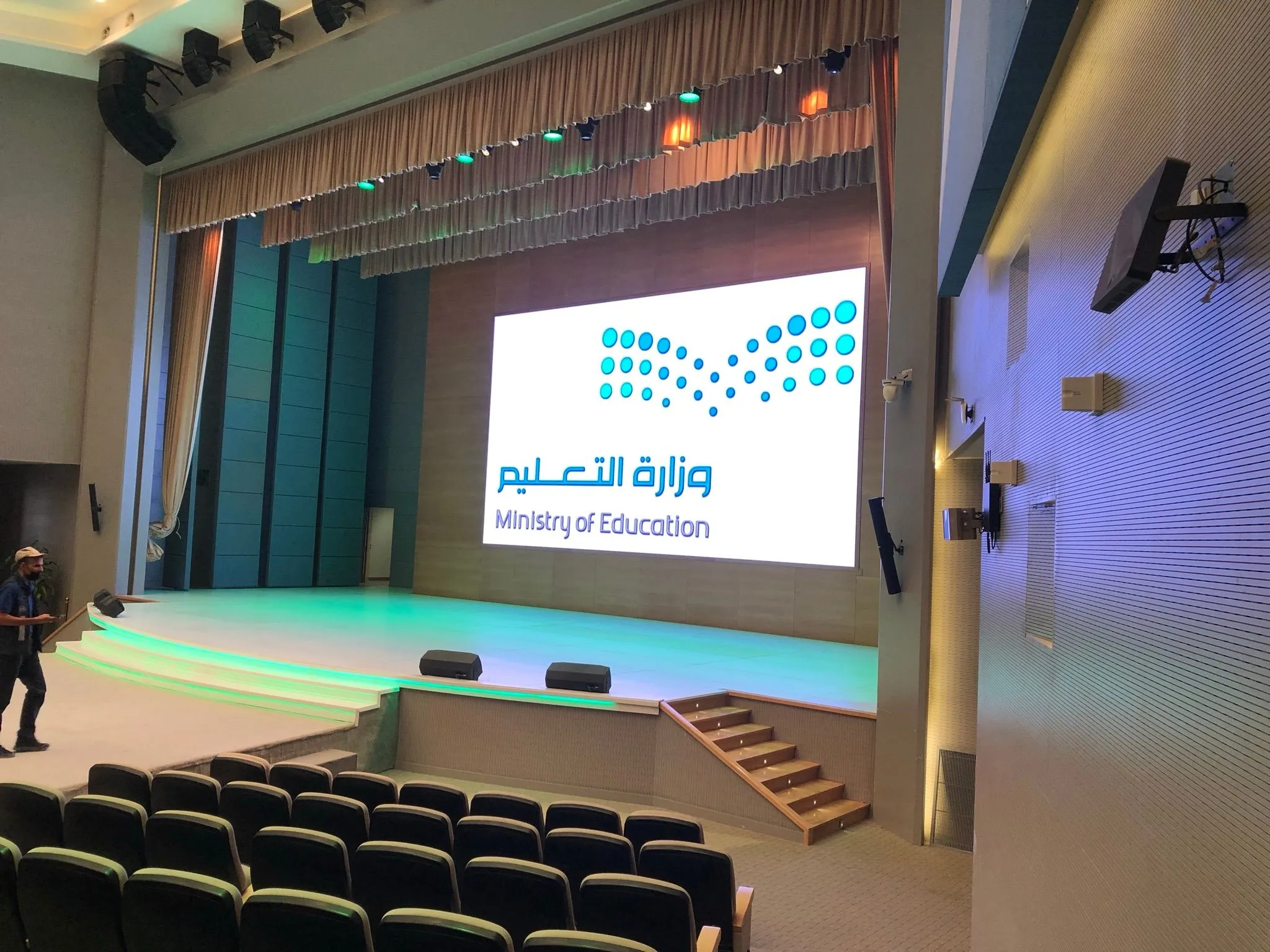Auditorium stage with a large LED screen